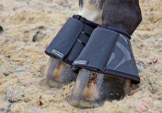 Pictured are Hy over reach boots on a horse's front hooves